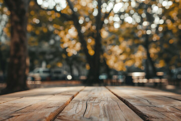 Poster - Empty wooden table in autumn park with blurred trees in background in sunlight. Perfect for product display