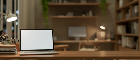 Poster - A wooden tabletop features a laptop mockup and accessories in a cozy contemporary office workspace.