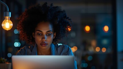 Poster - Pensive AfricanAmerican executive read information on laptop in dark empty office Businesswoman work on computer late in modern office : Generative AI