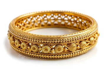 Golden bangle with beautiful work close view ideal for wedding isolated on white background. Gold jewellery stock photo.