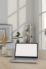 Wall Mural - A close-up image of a laptop computer mockup on a wooden table in a minimalist white room.