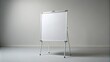 © Wanlop - Empty realistic white board with slight scratches and shadows stood upright on clean isolated light gray studio background.