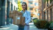 © GoodandEvil - Doctor carrying boxes on the street near buildings
