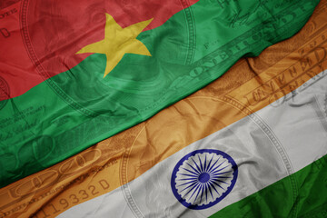 Poster - waving colorful flag of india and national flag of burkina faso on the dollar money background. finance concept.