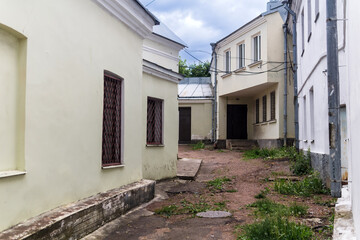 Wall Mural - town background, provincial courtyard among old buildings