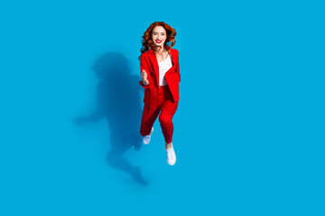 Canvas Print - Photo of charming crazy lovely girl wear red trendy clothes run fast isolated on blue color background