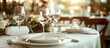 © YUTTADANAI - Elegant Table Setting with Wine Glasses and Plates in a Sunlit Restaurant for a Special Occasion