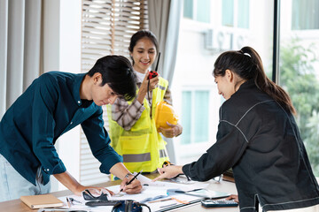 Wall Mural - team of engineer collaboration on project plan in modern office setting