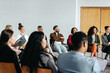 © Jacob Lund - Diverse group of professionals attentively participating in a corporate workshop