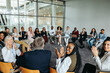 © Jacob Lund - Group participating in workshop with applause in modern office space