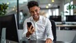 © gaitsaa - Businessman using smartphone in modern office, smiling
