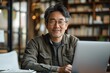 © Katsiaryna - The photo of an Asian man in his 40s working as a university professor