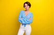 © deagreez - Photo of shiny confident young lady dressed flower print top smiling arms crossed isolated yellow color background