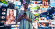 © Gorodenkoff - Portrait Of Caucasian Man Using Smartphone in 3D Cyberspace With Animated Social Media Interfaces, Online Games, Videos, and Internet Content. Visualization Of Male Enthusiast Surfing Web Network.
