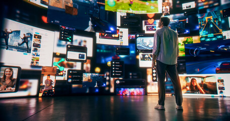 Wall Mural - back view of caucasian man enjoying 3d cyberspace with animated social media interfaces, online vide