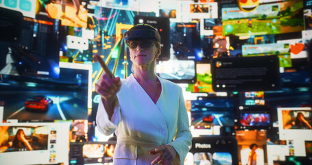 Wall Mural - portrait of caucasian woman wearing augmented reality glasses and gesturing to surf through multimed