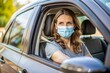 © Adisorn - Covid vaccination, car drive, and woman with mask for outside clinic or hospital safety, compliance, and healthcare. Person at covid 19 drive-thru for corona virus vaccine