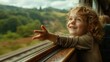© Attasit - A child excitedly pointing out the window at passing scenery, capturing the wonder of train travel