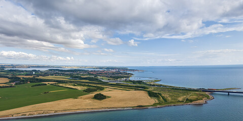 Wall Mural - Korser, Denmark. Toll booth for the Great Belt Bridge. Panorama in summer. Cloudy weather. Aerial view