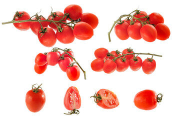 Wall Mural - Small red tomatoes isolated and levitatng on a white background. Cut out vegetables for montage of products in the photo.