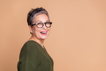 Sticker - Side profile photo of good mood woman with short hair dressed sweater in glasses toothy smiling isolated on beige color background