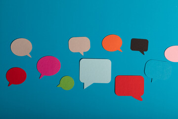 A blue background with colorful speech bubbles