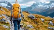 © Pinklife - A solo hiker wearing a yellow backpack treks along a rugged mountain trail, capturing the spirit of adventure, exploration, and connection with nature amidst scenic peaks.