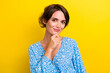 © deagreez - Photo of nice gorgeous woman with bob hairstyle dressed print blouse hand on ching think ideas isolated on yellow color background