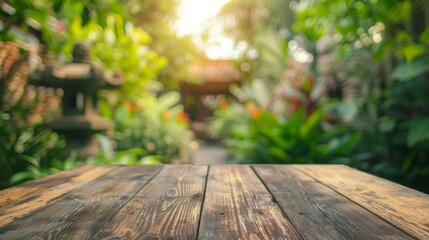 Poster - A wooden tabletop sits in the foreground of a lush, green garden. Sunlight peeks through the leaves, creating a warm and inviting atmosphere.