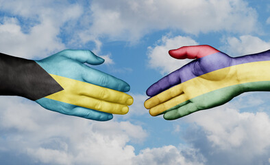 Mauritius and Bahamas country handshaking with flags, consensus concept international co-operation illustration