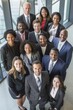 © JackBoiler - Confident Multicultural Team of Professionals in Modern Office Setting.