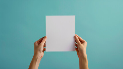 person hand holding blank white paper sheet isolated on color background copy space for text 