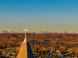 © Designpics - Church steeple with cross overlooking residential district at sunrise, Calgary, Alberta, Canada