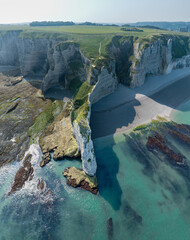 Canvas Print - Aerial view of Etretat cliffs and the Atlantic ocean. Chalk cliffs and three natural arches. Panoramic path to admire the coast. Normandy region of Northwestern France. 06-26-2024