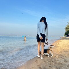 girl and dog on the beach