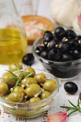 Wall Mural - Black and green olives in glass bowls