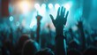 ©  lukaPixMedia - A vibrant concert scene shows a crowd with raised hands, immersed in the music and lively atmosphere, capturing the communal joy, excitement, and energy of live performances.