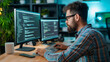 © Kyuubisa - Male programmer at work, man coding and sitting in front of a monitor at a computer