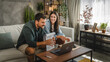 © Miljan Živković - couple work from home on laptop and have video call consultation