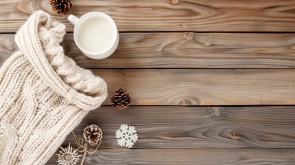 A white knit cap and a mug of milk sit on a wooden table. The scene is cozy and inviting, with the warm colors of the knit cap and the milk contrasting against the natural wood grain of the table