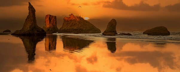 Wall Mural - Silhouettes of Sea Stacks at sunset on the southern Oregon coast at Bandon.