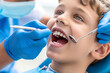 © Виктория Марьенко - A young patient in a dental chair is having her teeth checked by a dentist