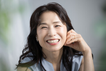 Close-up of a beautiful middle aged woman in her 50's with a smile. For beauty and other images.