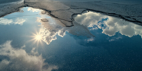 Wall Mural - A reflection photography of a bright, cloudless sky reflected in a shimmering heatwave over asphalt