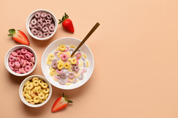 Poster - Bowls of colorful sweet cereal rings with milk and strawberries on brown background