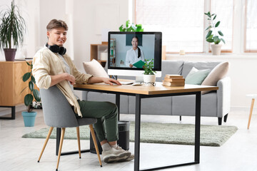 Poster - Male student studying with online teacher at home