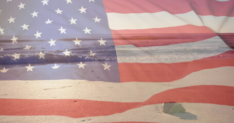 Wall Mural - Image of american flag over sea and sunny sand beach with rock