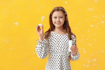 Sticker - Cute girl with soap bubbles on yellow background