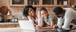 © Prostock-studio - Friendly black family using laptop at kitchen, looking for healthy food recipe, panorama with copy space