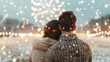© LifeMedia - A couple enjoys a romantic moment bundled in warm clothes as they watch fireworks illuminate the wintry skies, capturing the essence of love and celebration during the festive season.